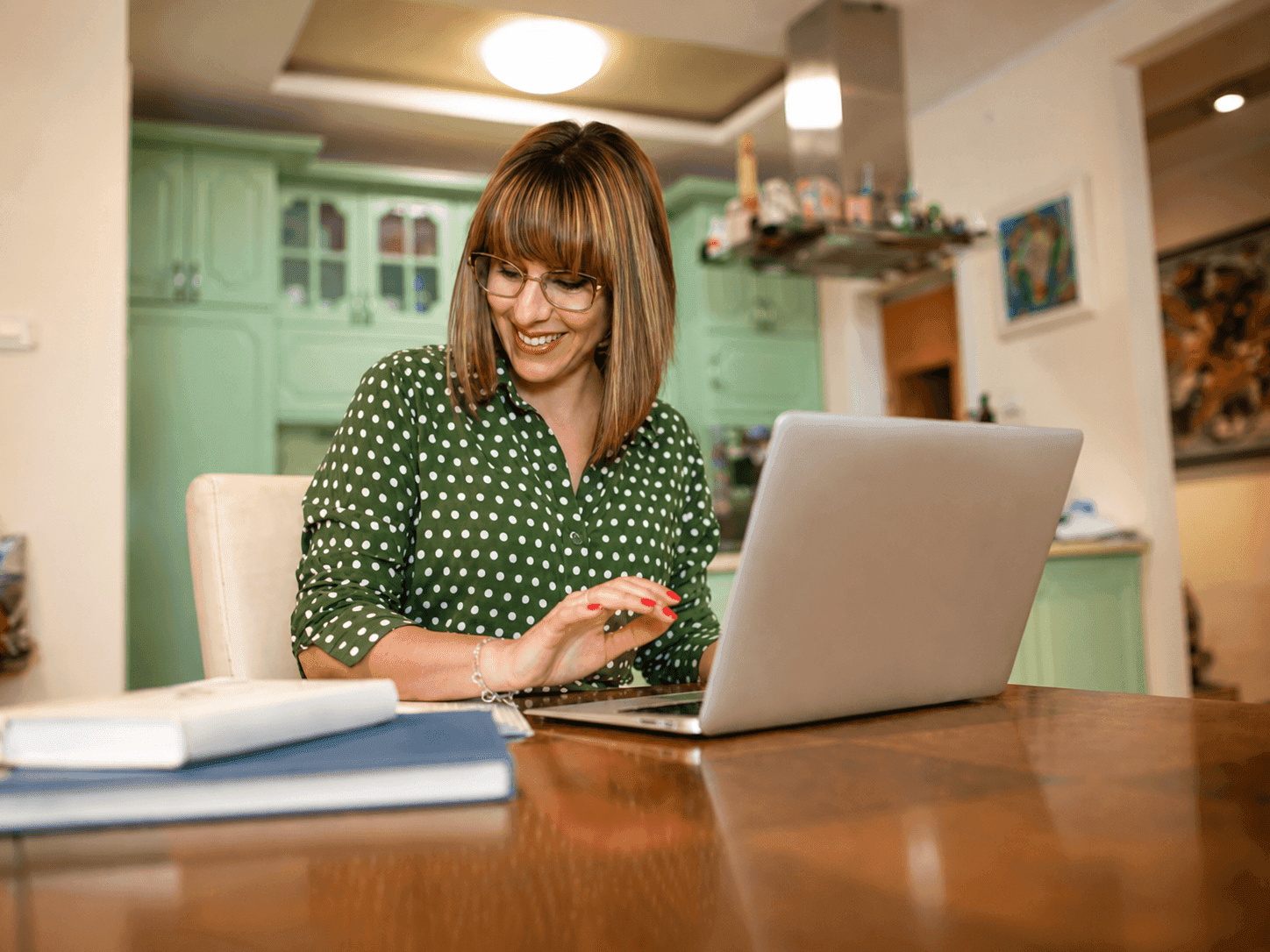 An SLP working at her laptop